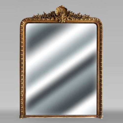 Gilded Louis XV style trumeau adorned with a shell framed by flowers