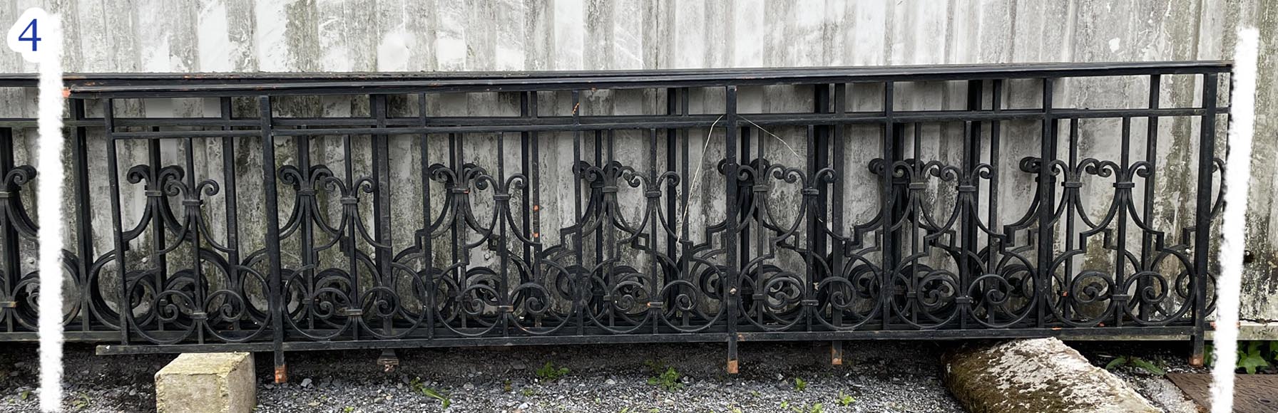 Set of wrought-iron railings featuring a design of scrolls and volute terminals, including both straight and raked sections Set of wrought-iron railings featuring a design of scrolls and volute terminals, including both straight and raked sections-4