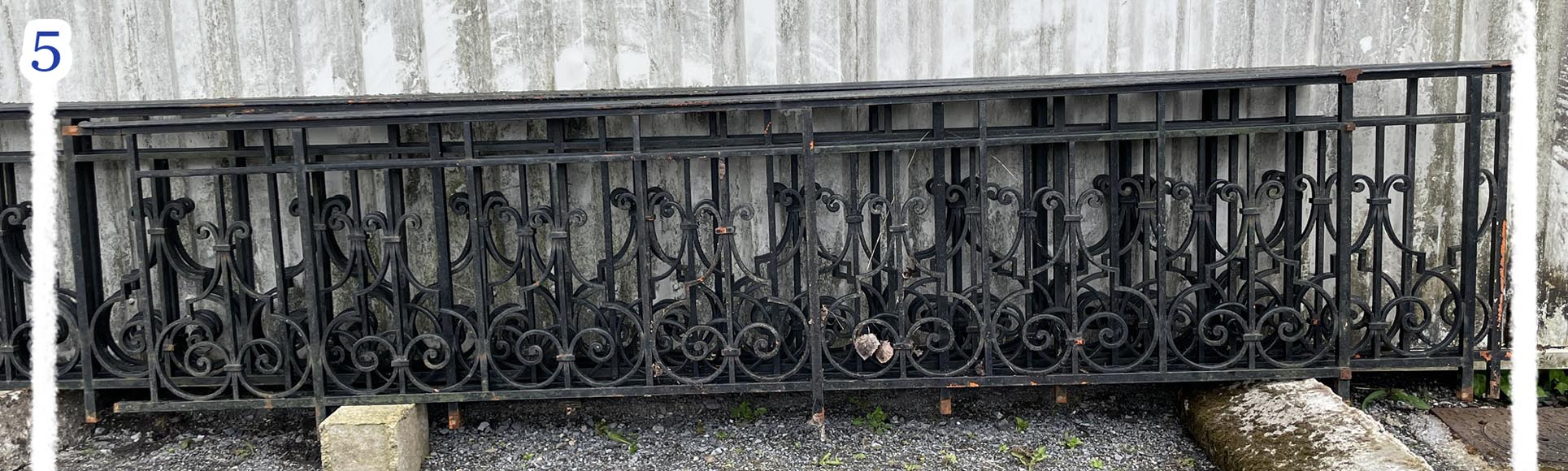 Set of wrought-iron railings featuring a design of scrolls and volute terminals, including both straight and raked sections Set of wrought-iron railings featuring a design of scrolls and volute terminals, including both straight and raked sections-5