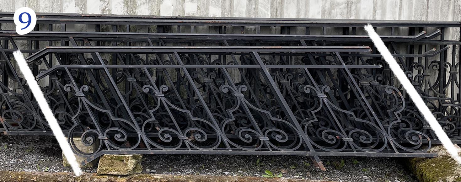Set of wrought-iron railings featuring a design of scrolls and volute terminals, including both straight and raked sections Set of wrought-iron railings featuring a design of scrolls and volute terminals, including both straight and raked sections-9