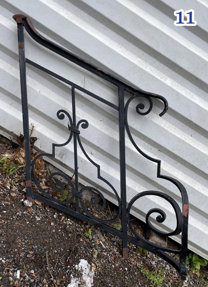 Set of wrought-iron railings featuring a design of scrolls and volute terminals, including both straight and raked sections Set of wrought-iron railings featuring a design of scrolls and volute terminals, including both straight and raked sections-11