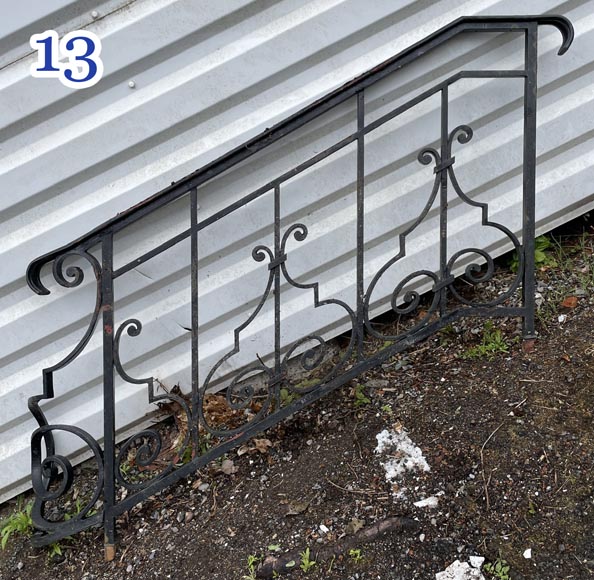 Set of wrought-iron railings featuring a design of scrolls and volute terminals, including both straight and raked sections Set of wrought-iron railings featuring a design of scrolls and volute terminals, including both straight and raked sections-13
