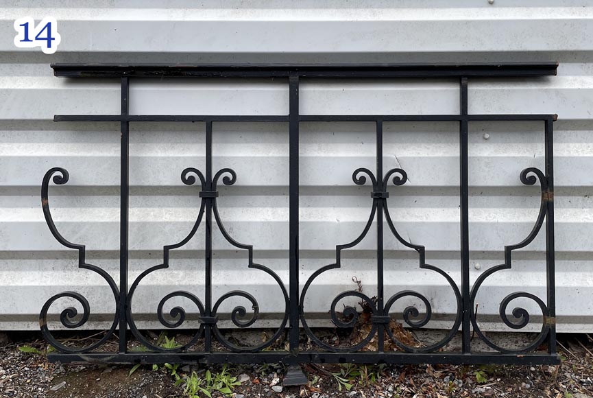Set of wrought-iron railings featuring a design of scrolls and volute terminals, including both straight and raked sections Set of wrought-iron railings featuring a design of scrolls and volute terminals, including both straight and raked sections-14