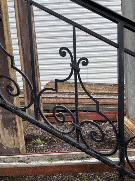 Set of wrought-iron railings featuring a design of scrolls and volute terminals, including both straight and raked sections Set of wrought-iron railings featuring a design of scrolls and volute terminals, including both straight and raked sections-18