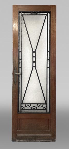 Art Deco interior door in wood and wrought metal, featuring geometric ornamentation and textured glass-0