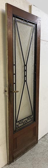 Art Deco interior door in wood and wrought metal, featuring geometric ornamentation and textured glass-2