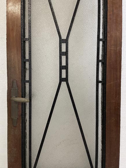 Art Deco interior door in wood and wrought metal, featuring geometric ornamentation and textured glass-4