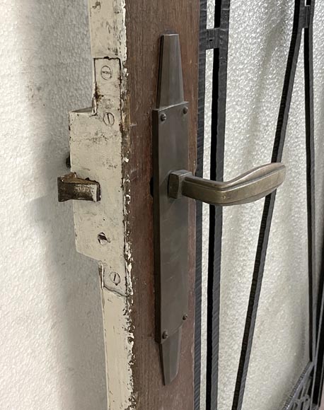 Art Deco interior door in wood and wrought metal, featuring geometric ornamentation and textured glass-6