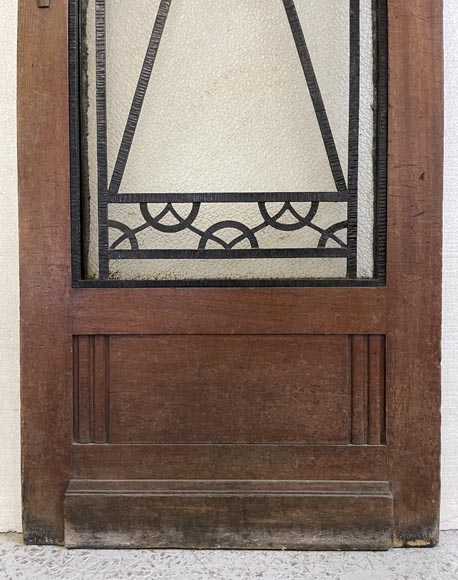 Art Deco interior door in wood and wrought metal, featuring geometric ornamentation and textured glass-8