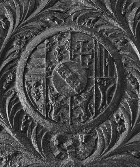 18th-century fireback featuring a coat of arms framed by musical angels-1