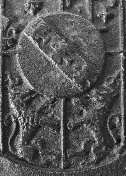 18th-century fireback featuring a coat of arms framed by musical angels-2