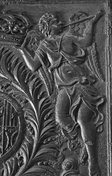 18th-century fireback featuring a coat of arms framed by musical angels-5