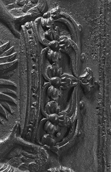 18th-century fireback featuring a coat of arms framed by musical angels-7
