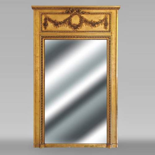Gilt Louis XVI-style trumeau mirror with a floral wreath