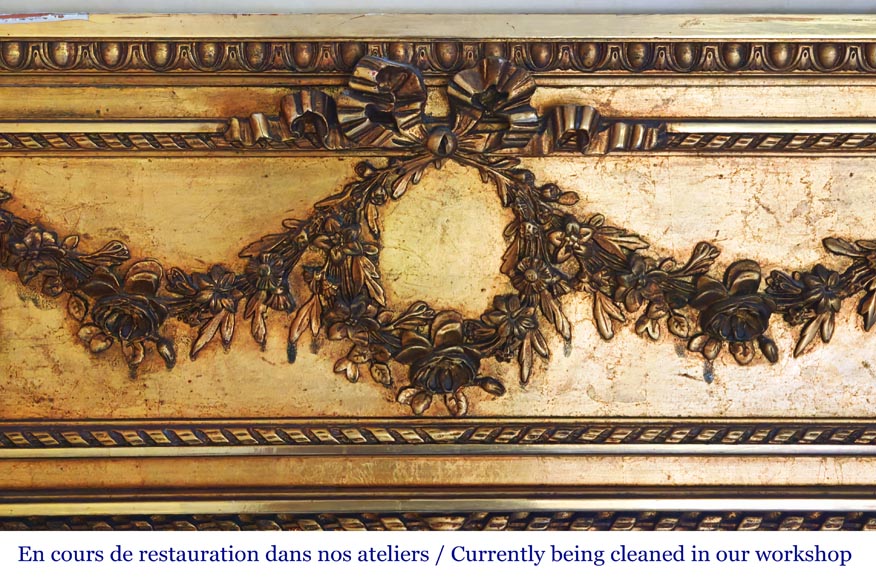 Gilt Louis XVI-style trumeau mirror with a floral wreath-1
