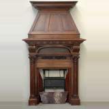 Antique Walnut hooded mantel from the 19th century