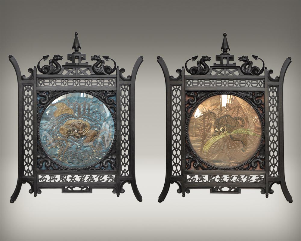 Pair of Japaneseblackened wooden frames decorated with embroidered