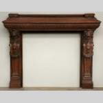 Antique mahogany mantel with lion heads
