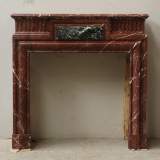 Louis XIV style mantel in Rouge du Nord marble