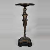 Patinated bronze pedestal table with Hermes