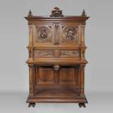 Neo-Renaissance style carved walnut credenza with profiles of costumed characters