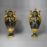 A pair of giltbronze mounted Sea Green marble covered vases with Egyptian women