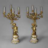 Beautiful antique pair of candelabras made out of Statuary Carrara marble and gilded bronze with putti and roses decor