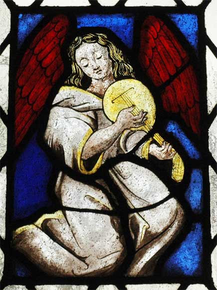 Two stained glasses elements with a harpist and a guitarist angels-1