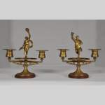 "The Bacchanal", pair of gilded bronze and Red Griotte marble candlesticks