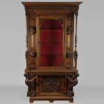 BELLANGER, cabinetmaker - Neo-Renaissance style display cabinet made out of carved walnut with chimeras decor