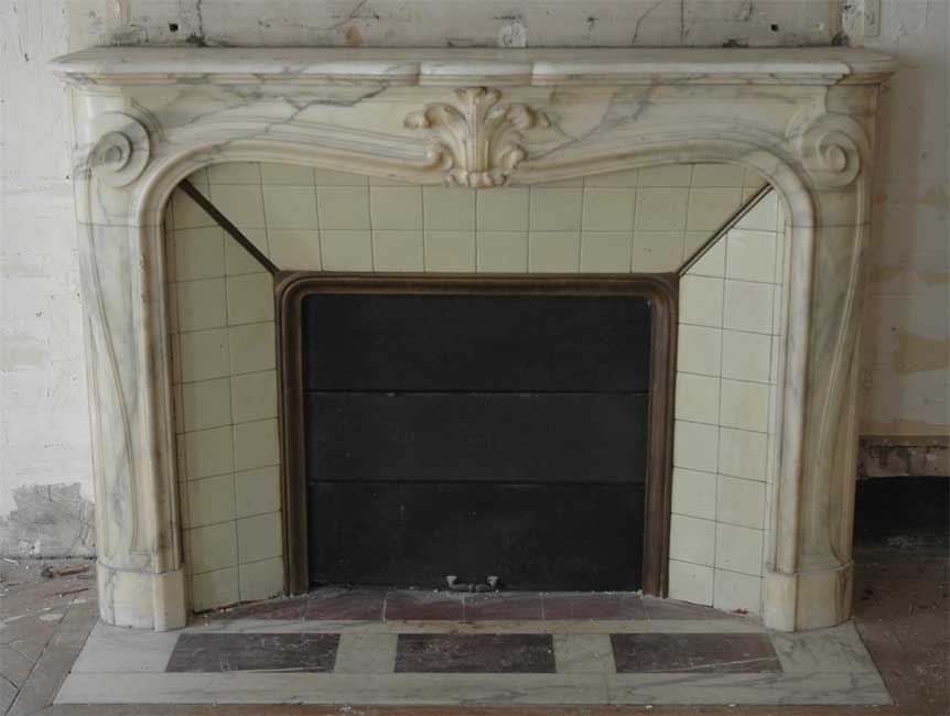 Antique Louis XV style fireplace in a Grey Panazeau marble