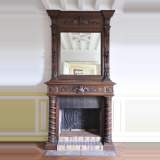 Antique walnut fireplace with Satyr mask
