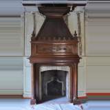 Large antique Neo-Gothic style fireplace made out of walnut wood