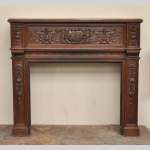 Antique Napoleon III style oak wood fireplace with 