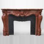 Very beautiful antique Louis XV style opulent fireplace made out of Red Griotte marble