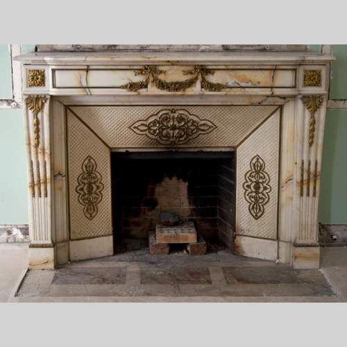 Beautiful antique Louis XVI style fireplace in Escalette marble with