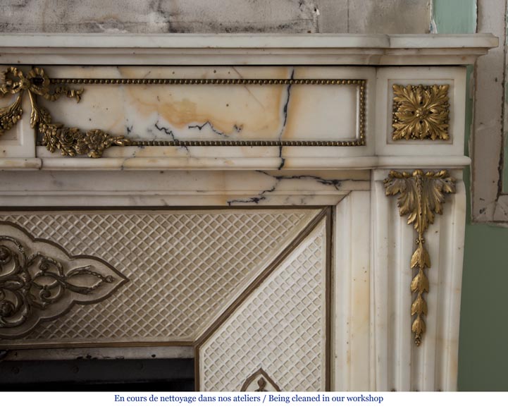 Very beautiful antique Louis XVI style fireplace made out of Panazeau marble with gilded bronze ornaments-12