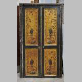 Double door with frame with putti and flowers decor on gold painting background