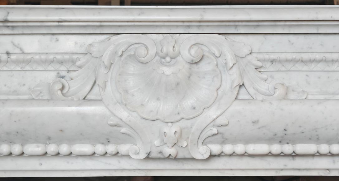 Louis XIV-style fireplace in Carrara marble, featuring a beaded molding Louis XIV-style fireplace in Carrara marble, featuring a beaded molding-1