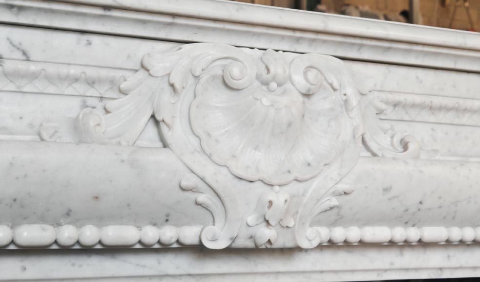 Louis XIV-style fireplace in Carrara marble, featuring a beaded molding Louis XIV-style fireplace in Carrara marble, featuring a beaded molding-2
