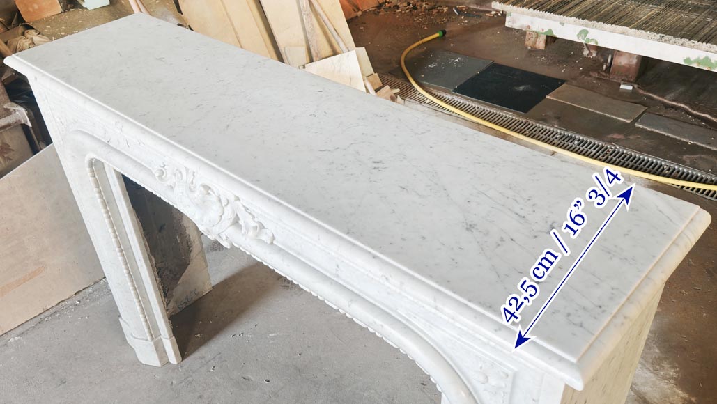 Louis XIV-style fireplace in Carrara marble, featuring a beaded molding Louis XIV-style fireplace in Carrara marble, featuring a beaded molding-11