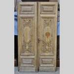 Carved oak wood double door with grotesque decor