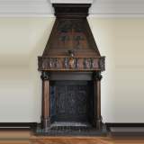 Monumental antique Neo-Gothic style fireplace with hood made out of carved walnut and courtly scenes
