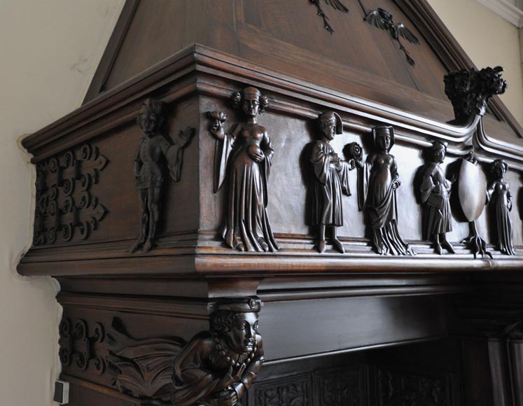 Monumental antique Neo-Gothic style fireplace with hood made out of carved walnut and courtly scenes-3