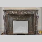 Antique Louis XV style fireplace in Red from the North marble, 19th century