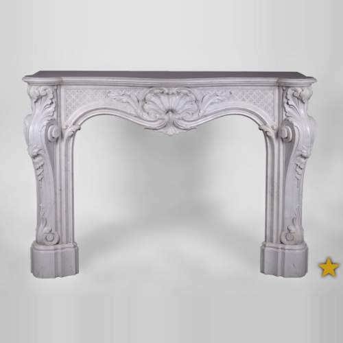 Beautiful antique Louis XV style fireplace with opulent decor in white Carrara marble