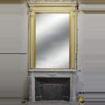 Large Louis XVI style fireplace in white Carrara marble with its cast iron insert and its overmantel mirror