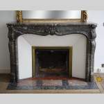 Antique Louis XV period fireplace in Grey Sainte Anne marble, 18th century