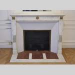 Antique Louis XVI style fireplace in white Carrara marble with gilt bronze ornaments