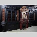 Rare Napoleon III paneled room in blackened wood with its monumental fireplace in stucco in imitation of porphyry